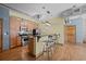 Kitchen with breakfast bar, stainless steel appliances, and hardwood flooring at 3299 Lowell Blvd # 204, Denver, CO 80211