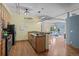 An open concept kitchen with granite countertops and a view into the living room at 3299 Lowell Blvd # 204, Denver, CO 80211