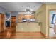 Open kitchen boasts granite counters, wood cabinets and stainless-steel appliances at 3299 Lowell Blvd # 204, Denver, CO 80211
