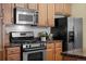 Kitchen featuring stainless steel appliances and granite countertops at 3299 Lowell Blvd # 204, Denver, CO 80211