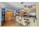 Open kitchen and bar area with stainless appliances and hardwood floors at 3299 Lowell Blvd # 204, Denver, CO 80211