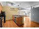 Open-concept kitchen features wooden cabinets and sleek appliances alongside a granite countertop breakfast bar at 3299 Lowell Blvd # 204, Denver, CO 80211