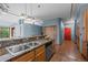 Stylish kitchen featuring granite counters, stainless steel sink, and modern appliances at 3299 Lowell Blvd # 204, Denver, CO 80211