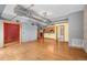 Spacious living room showcasing wood floors, and an open floor plan with a view to kitchen at 3299 Lowell Blvd # 204, Denver, CO 80211