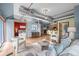 Open-concept living room with ductwork, view of bedroom, and kitchen at 3299 Lowell Blvd # 204, Denver, CO 80211