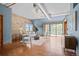 Stylish living room with modern furniture, brick wall, ductwork, and outdoor access at 3299 Lowell Blvd # 204, Denver, CO 80211