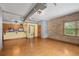 Spacious living area features exposed ductwork and a cozy sitting area with lots of natural light at 3299 Lowell Blvd # 204, Denver, CO 80211