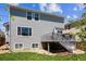 Back exterior of house features a deck with stairs leading to a well-manicured lawn at 11866 High Desert Rd, Parker, CO 80134