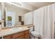 Clean bathroom featuring neutral tones, a shower curtain, and a single vanity at 11866 High Desert Rd, Parker, CO 80134