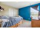 Brightly colored bedroom features unique built in shelving and a window with natural light at 11866 High Desert Rd, Parker, CO 80134