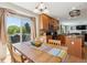 Bright dining room with sliding glass door, table and chairs at 11866 High Desert Rd, Parker, CO 80134