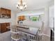 Well-lit dining room showing views into kitchen and living room at 11866 High Desert Rd, Parker, CO 80134