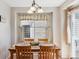 Dining room features a wood table and decorative lighting at 11866 High Desert Rd, Parker, CO 80134