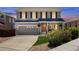 Charming two-story home featuring a well-manicured lawn, inviting front porch, and attached two-car garage at 11866 High Desert Rd, Parker, CO 80134