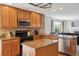Well-lit kitchen has granite countertops and stainless steel appliances at 11866 High Desert Rd, Parker, CO 80134