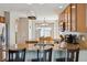 Kitchen featuring granite countertops, stainless steel appliances, and barstool seating at 11866 High Desert Rd, Parker, CO 80134