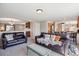 Spacious living room showing entry to kitchen and stairway at 11866 High Desert Rd, Parker, CO 80134