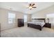 Spacious main bedroom with high ceilings, plush carpeting, and plenty of natural light at 11866 High Desert Rd, Parker, CO 80134