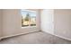 Neutral bedroom with window view and closet at 8707 E Florida Ave # 709, Denver, CO 80247