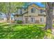 Inviting two-story home with lush green lawn and mature trees at 8707 E Florida Ave # 709, Denver, CO 80247
