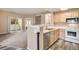 Bright kitchen with stainless appliances and access to balcony at 8707 E Florida Ave # 709, Denver, CO 80247