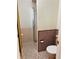 Bathroom with mosaic tile floors and a walk-in shower with glass door at 2789 S Ivan Way, Denver, CO 80227