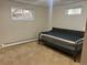 Bedroom with a small bed frame, carpet flooring, and natural lighting at 2789 S Ivan Way, Denver, CO 80227