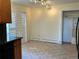 Bright dining area featuring tile floors, closet space, and sliding doors with plantation shutters at 2789 S Ivan Way, Denver, CO 80227