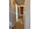 Hallway with hardwood floors and built-in wooden cabinet at 2789 S Ivan Way, Denver, CO 80227