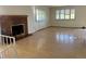 Spacious living room with brick fireplace and hardwood floors at 2789 S Ivan Way, Denver, CO 80227