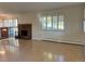 Open living room with lots of natural light, brick fireplace, and hardwood floors at 2789 S Ivan Way, Denver, CO 80227