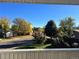 Neighborhood street view from balcony on a clear day featuring tree-lined street at 2789 S Ivan Way, Denver, CO 80227