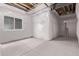Unfinished basement with insulated walls, exposed ductwork, and concrete flooring at 5608 Grandville Ave, Longmont, CO 80503