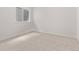 Basement featuring carpet flooring, a window, and white walls, providing a versatile living space at 5608 Grandville Ave, Longmont, CO 80503