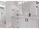 Modern bathroom featuring a double sink vanity with modern fixtures and a glass-enclosed shower at 5608 Grandville Ave, Longmont, CO 80503
