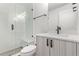 Modern bathroom featuring a glass shower enclosure, sink, and vanity with modern fixtures at 5608 Grandville Ave, Longmont, CO 80503