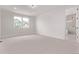 Spacious carpeted bedroom with abundant natural light and an ensuite bathroom at 5608 Grandville Ave, Longmont, CO 80503