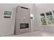 Modern fireplace with stylish tile accents and windows offering natural light at 5608 Grandville Ave, Longmont, CO 80503