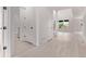 Bright foyer featuring sleek flooring and access to rooms with black hardware at 5608 Grandville Ave, Longmont, CO 80503