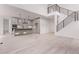 Open-concept living area and modern kitchen with bright natural light at 5608 Grandville Ave, Longmont, CO 80503