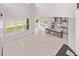 Bright open-concept living space with island kitchen and large windows overlooking the backyard at 5608 Grandville Ave, Longmont, CO 80503