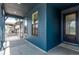 Inviting covered porch with elegant railings and a view of the neighborhood at 5608 Grandville Ave, Longmont, CO 80503