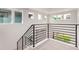 Modern staircase with black metal railing leading to the upper level of the home at 5608 Grandville Ave, Longmont, CO 80503