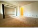 Bright bedroom with mirrored closet doors and neutral walls at 1074 S Dearborn St # 306, Aurora, CO 80012