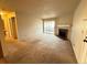 Spacious living room featuring a fireplace and sliding glass door to balcony at 1074 S Dearborn St # 306, Aurora, CO 80012