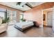 Modern bedroom featuring large windows, concrete floors, and a minimalist aesthetic at 2100 16Th St # 408, Denver, CO 80202