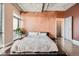 Cozy bedroom with textured walls, large windows and minimalist decor at 2100 16Th St # 408, Denver, CO 80202