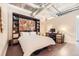 Bright bedroom space with workstation and stylish industrial finishes at 2100 16Th St # 408, Denver, CO 80202