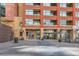 Exterior view of entrance showing brick and glass entryway with landscaping at 2100 16Th St # 408, Denver, CO 80202