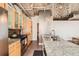 Kitchen featuring granite countertops, stainless steel appliances, and modern lighting at 2100 16Th St # 408, Denver, CO 80202